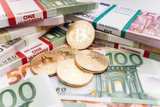 Crypto currency concept - a bitcoin with euro bills